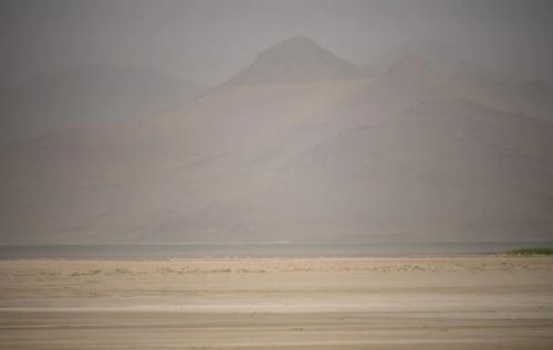(Trent Nelson | The Salt Lake Tribune) Dust obscures Antelope Island and the Great Salt Lake on Saturday, June 18, 2022. The lake has hit another record low.